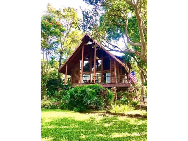 Large teak wood house for sale, surrounded by nature on over 1 rai of land, with the option to purchase additional land.